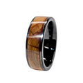 Wooden inlay ring with black metal band on a white background